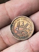Reverse with fish design, denomination 3, legend 'GOVERNMENT OF CYPRUS THREE 1955'