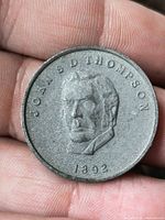 Obverse with portrait of John S. D. Thompson and date 1892