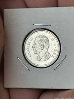 Obverse showing King Charles III effigy in 2x2 flip