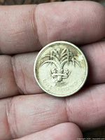 Reverse showing leek through coronet and ONE POUND legend