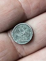 Reverse view showing St. George motif and 1902 date