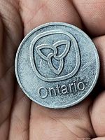 Obverse side with stylized trillium and Ontario text