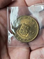 Obverse of Quebec 1967 medallion showing coat of arms and legends