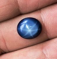 Top view showing star asterism on blue cabochon