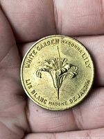 Obverse showing lily design and English/French text