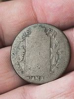 obverse showing worn wreath border and partial lettering