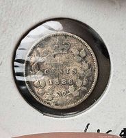 Reverse of 1886 Canada 5 cent coin showing wreath and date