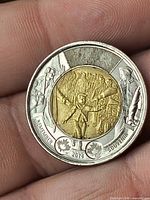 Reverse side of commemorative toonie showing WWI design and 2014 date