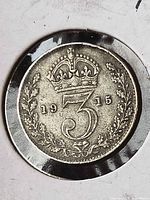 Reverse of 1915 sterling threepence with crowned 3 and wreath