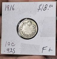 Coin in 2x2 holder reverse visible with wreath and date
