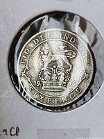 Reverse of 1916 sixpence showing lion on crown and date