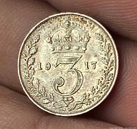Reverse of 1917 threepence showing crown, wreath, date
