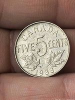 Reverse showing CANADA FIVECENTS 5 maple leaves and date 1933