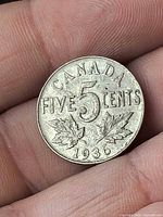 Reverse of 1936 Canadian nickel showing CANADA FIVE 5 CENTS 1936 and maple leaves