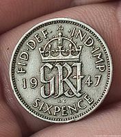 Reverse of 1947 sixpence showing crowned GR monogram and date