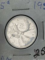 Reverse showing caribou and 1954 date
