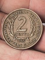 Reverse of 1955 British Caribbean Territories 2 cents coin showing wreath and denomination