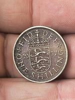 Reverse side showing crowned English shield and 1957 date