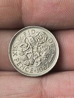 Reverse side with floral emblems and date 1967