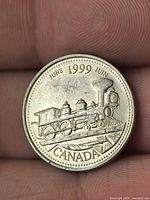 Reverse showing steam locomotive, date and country legends