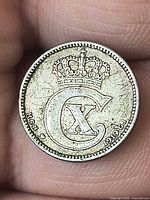 Obverse showing crowned CX monogram and split date 19 20