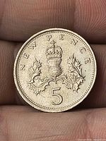 Reverse side displaying crowned thistle and denomination