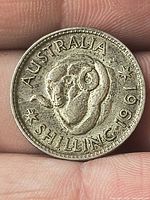 Reverse showing ram’s head design and 1961 date