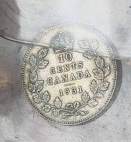 reverse of 1931 10-cent coin showing crown, maple wreath and date