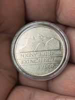 Obverse of coin showing Queen Beatrix text, inside capsule