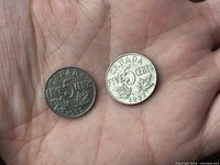 Obverse view of both coins showing CANADA FIVE CENTS 1932 design