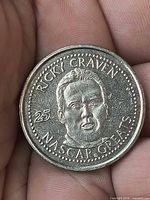 Obverse of coin showing Ricky Craven portrait and inscriptions