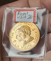 Obverse view showing dual portrait, text, and holder