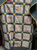 Full view of patchwork quilt showing blocks, sashing and border