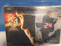Front view of Season 4 and Season 7 sealed DVD box sets