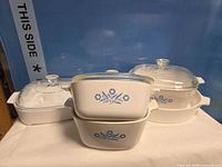 Group shot of all CorningWare dishes and lids