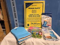 Group shot showing all six items including Sta-Wet sponge package, blue oven glove, Compliments latex gloves, Chore Boy sponges, Vileda cloth package, nitrile gloves pack