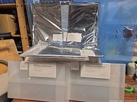 Stacked unopened portfolio books and protector packs