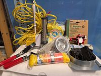 Wide view of assorted hardware and household items on table