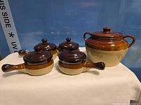 Front view of bean pot and four soup crocks