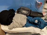 Group shot showing all clothing items and waist packs on table