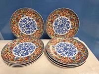 Eight decorative plates front view