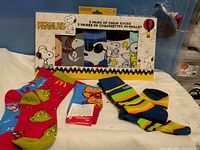 Peanuts 5-pair boxed sock set with three loose sock pairs displayed