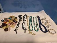 Group showing all jewellery items laid out on white background