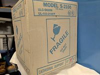 Front of box showing Model S-2100, fragile symbol, cathedral support, size indicators 6" / 8"