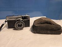 Front view of Olympus Trip 35 camera and soft case