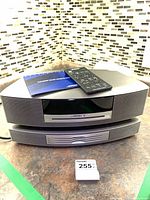 Wave Music System stacked on multi-CD changer with remote and manual