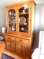 Full view of china cabinet showing upper glass doors, lower drawers and doors