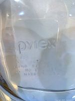 Embossed Pyrex mark on clear glass surface