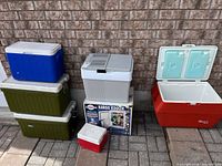 Group view of all six coolers against brick wall