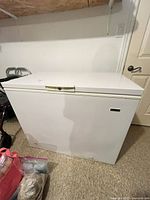 Front view of white Kelvinator chest freezer closed